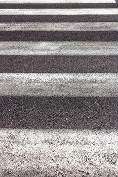 Front view of a pedestrianized crossing on asphalt.