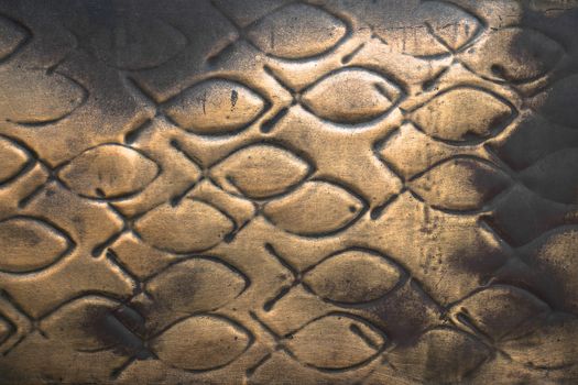 Pattern of fish engraved on a copper plate.
