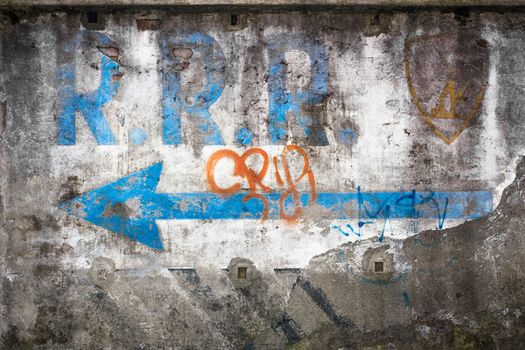 An old painting on the wall, faded by time.