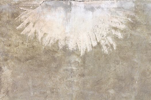 Front view of an old wall sand color, with light strokes at times.