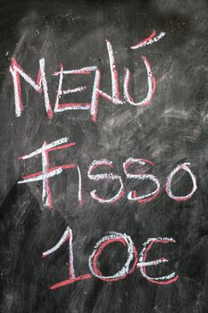 A menu for business lunch advertised on the blackboard.