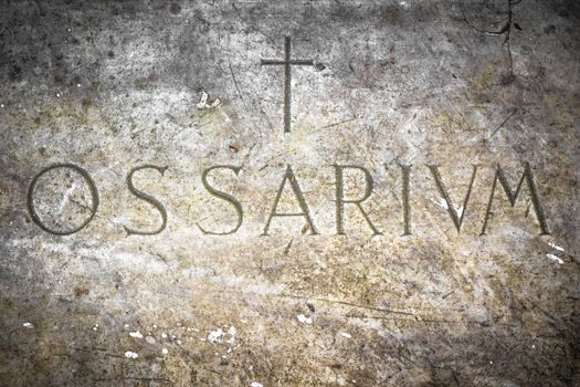 A tombstone dating back to medieval Italian, which houses the bones of plague victims of 1600.
