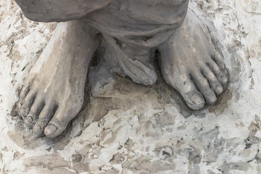 Marble sculpture depicting Jesus' feet.