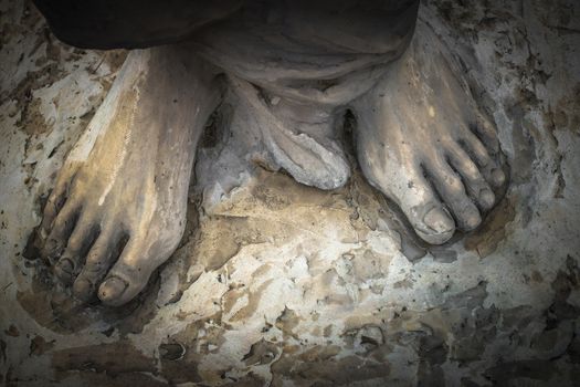 Marble sculpture depicting Jesus' feet.