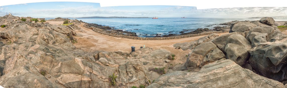 View of a camping site on Shark Island. Boats are visible