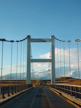 Jokulsarlon glacier lagoon bridge in Iceland at golden hour.