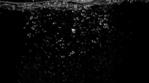 Water bubbles floating on black background with oil paint effect which represent refreshing of refreshment from soda or carbonated drink and power of liquid that splashing by air pump.