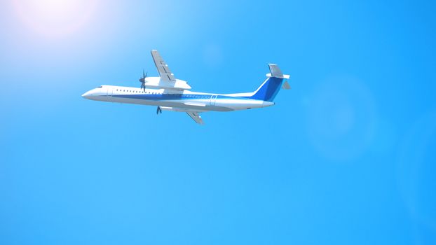 Airplane taking off to the blue sky from international airport runway in Sapporo Hokkaido Japan and have sun light flare to camera and shoot from uprisen or low angle view.