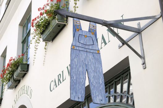 Shop sign in form of a dungarees.