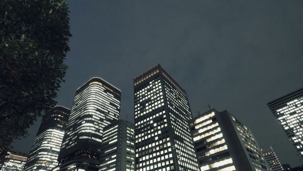 Low or uprisen angle view of modern skyscraper tower building in the night that represent futuristic architecture of office workplace in downtown area of Osaka Japan  