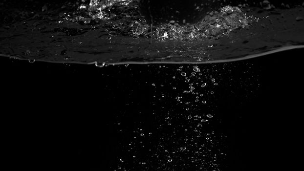 Water bubbles floating on black background which represent refreshing of refreshment from soda or carbonated drink and power of liquid that splashing or fizzing with blowing and streaming by air pump.