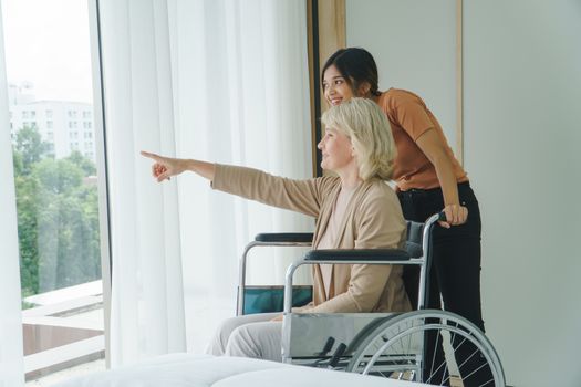 Happy senior mother and grow daughter Talk at home.  family of diverse skin. Concept of love sharing time Care for Grandmother, mother, daughter, granddaughter, and daughter-in-law in adoption