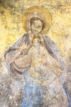 Ancient fresco of the Virgin Mary with the baby Jesus Christ (Religion, faith, eternal life, God, the soul concept).