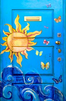 Graffiti at a door of a house in the street