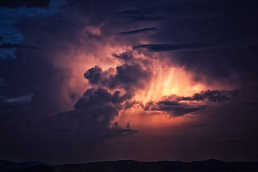 Cloud to cloud lightning illuminates a North Carolina thunderstorm over the Blue Ridge.