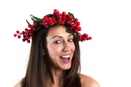 Christmas or New Year beauty woman portrait isolated on white background. Smiling young woman with wearing a Christmas wreath on her head. Natural makeup.