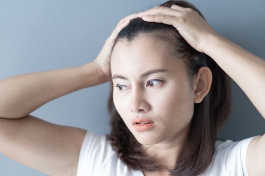 Woman serious hair loss problem for health care shampoo and beauty product concept, selective focus