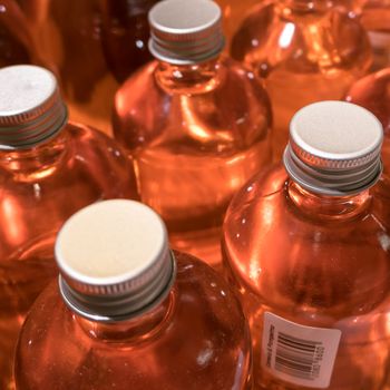 Close Up of orange cosmetic bottles. Ideal for concepts and backgrounds.