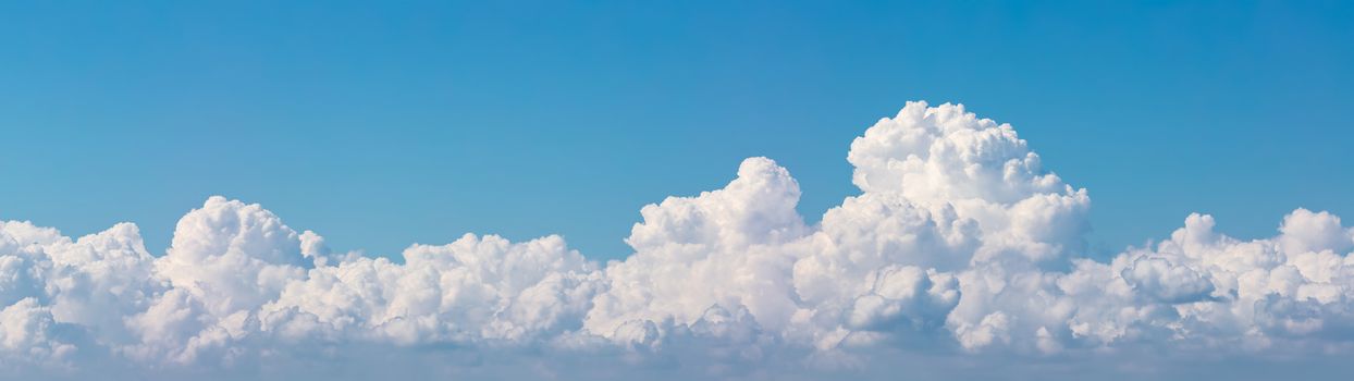 Beautiful panoramic view of white clouds with blue sky as a background. Amazing shape.