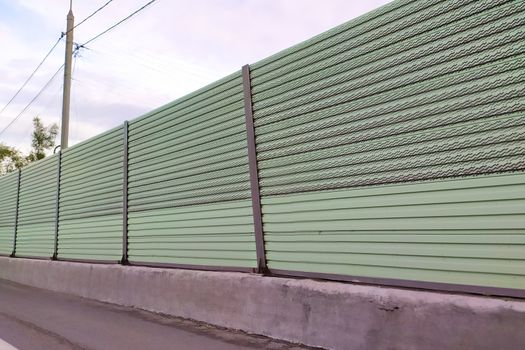 metal fence protecting the road