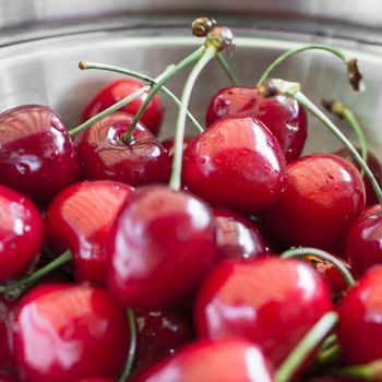 Close-up of amazing cherries served in a steel plate.