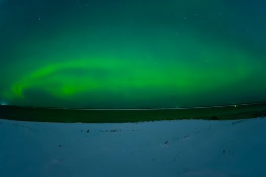 Northern Lights in the night sky. Northern Lights in the tundra.