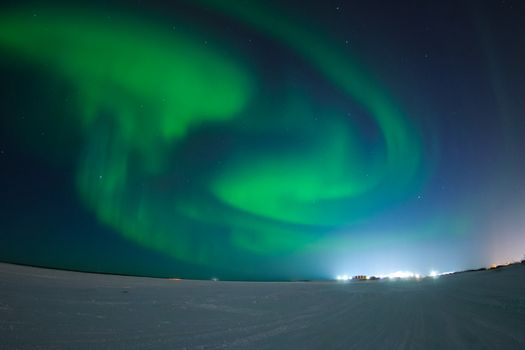 Northern Lights in the night sky. Northern Lights in the tundra.