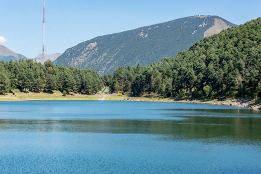 Summer afternoon at Lake Engolasters in the Pyrenees. Escaldes Engordany, Andorra.