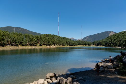 Escaldes Engodany, Andorra : 20 August 2020 : Tourists enjoying the Summer Afternoon at Lake Engolasters in the Pyrenees. Escaldes Engordany, Andorra in summer 2020