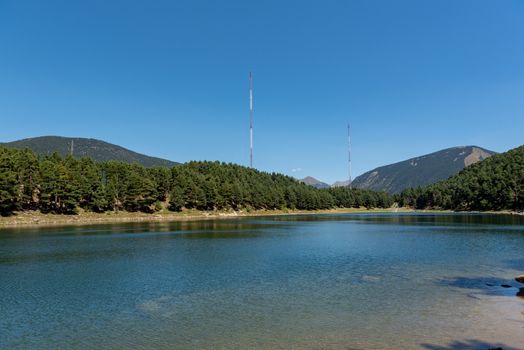 Summer afternoon at Lake Engolasters in the Pyrenees. Escaldes Engordany, Andorra.