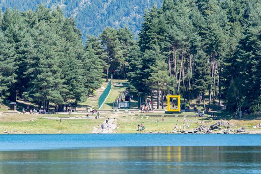 Escaldes Engodany, Andorra : 20 August 2020 : Tourists enjoying the Summer Afternoon at Lake Engolasters in the Pyrenees. Escaldes Engordany, Andorra in summer 2020