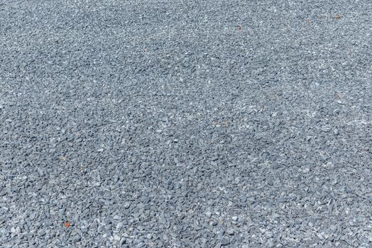 Center of image is point of greatest focus



Horizontal close-up shot of a prepped bed of crushed rock for a cement pour at a construction site.

