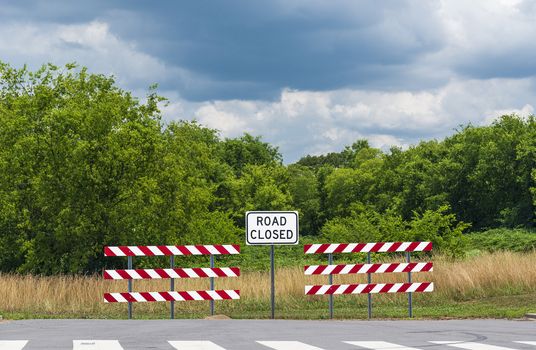 Horizontal shot of a road closed sign.