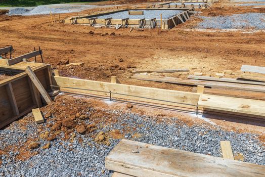 Horizontal shot of wooden molds to be filled with concrete in new construction.