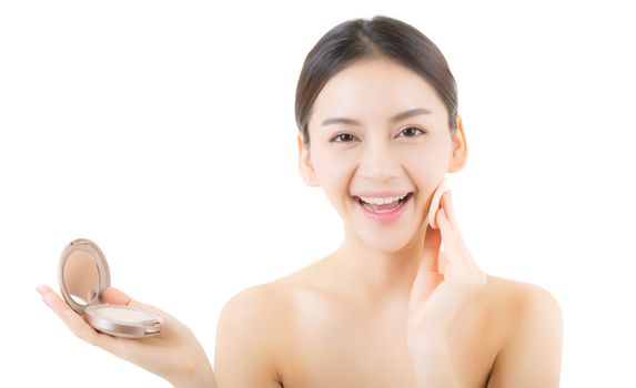 Asian woman beauty applying powder puff at cheek, cosmetics beautiful concept.