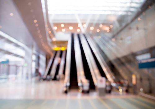 blur background of escalator at the airport for use.