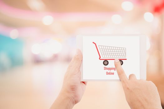 Man holding tablet, over blur or defocus image of department store or with bokeh background, shopping online concept.