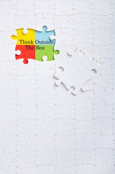 Jigsaw puzzle piece with word think outside the box, Quotes business concept