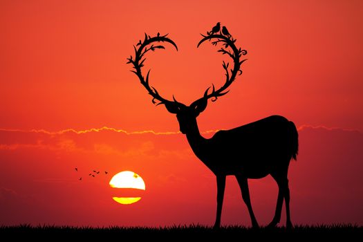 illustration of deer with horns a heart shape at sunset