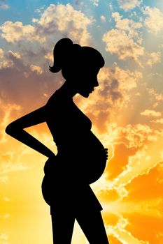 illustration of a pregnant woman at sunset