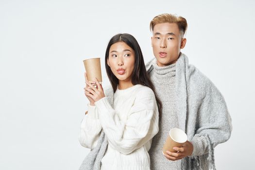 man and woman coffee ties warm drink winter clothes cool family