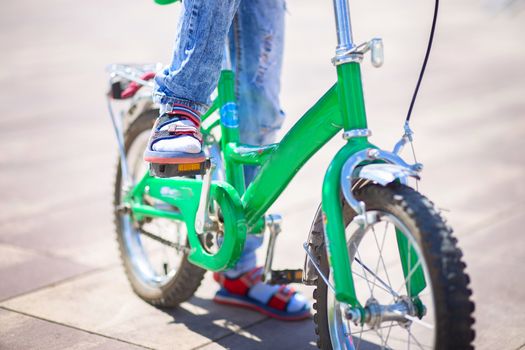 Bicycle pedal close up. The child is pedaling. Kids sports