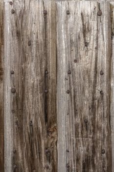 Old panel wood with rusty nails.