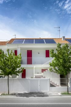 Photovoltaic solar panels on houses roof. Regenerative energy system electricity generation.