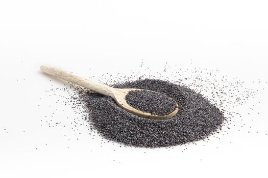 Poppy seeds in spoon isolated on white