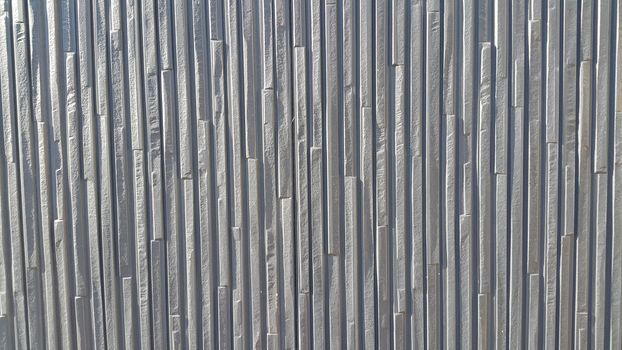 Close up view of wood stripes background of interior walls and floor texture. The wooden stripes repeatedly arranged to make wall or floor design.