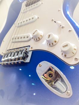 Close-up of a blue Electric guitar.