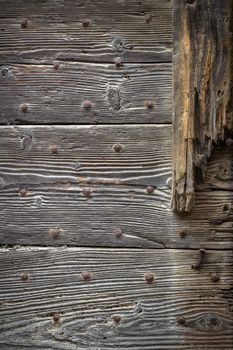 Gray wooden planks with rusted nails, background photo texture.