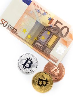 Financial concept with image of bitcoins on fifty euro banknote. Traditional money versus cryptocurrency concept.