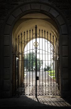 Beautiful view and light from arched passage of a medieval castle.